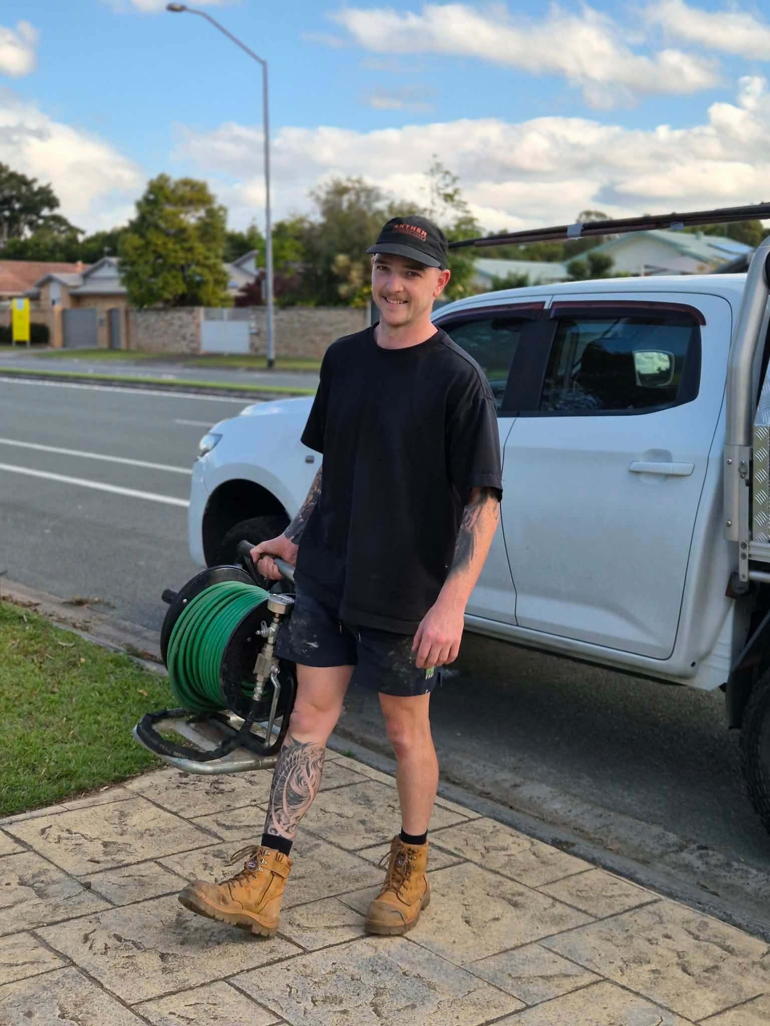 Mitch from DARK Plumbing with the work ute and drain jetter